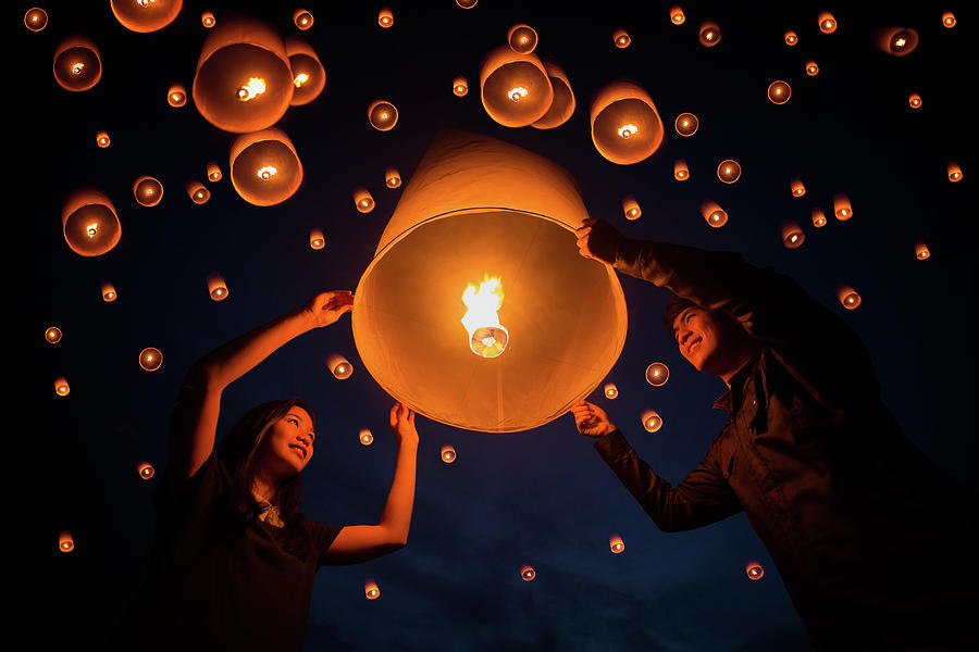 Christmas Photograph - Thai people floating lamp in Yeepeng festival by Anek Suwannaphoom