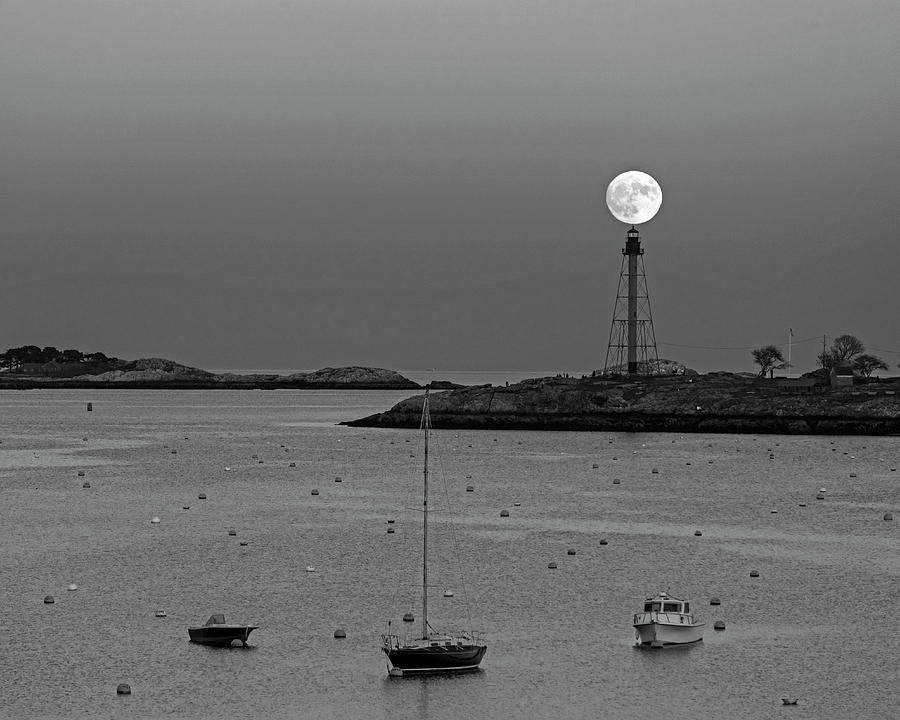 The 2016 Supermoon balancing on the Marblehead Light Tower in Marblehead MA Black and White Photograph by Toby McGuire