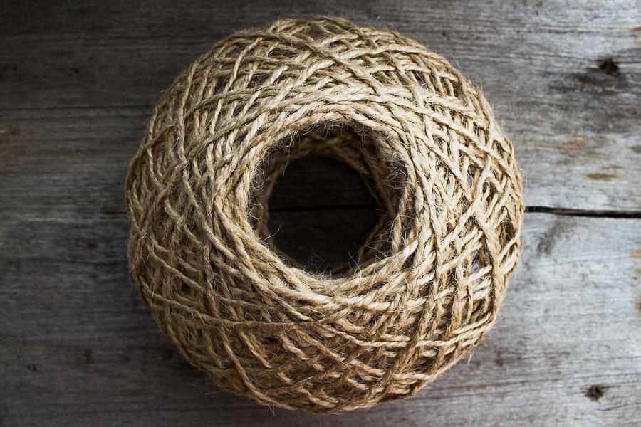 The ball of twine on a wooden table Photograph by Mikhail Piizzoff ...