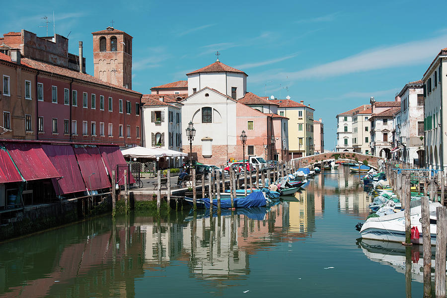 The canals of Chioggia, the small Venice. Reflections on the water ...