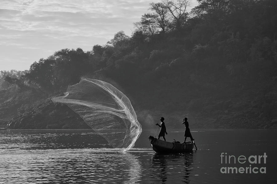 The catch for survival Photograph by Kiran Joshi