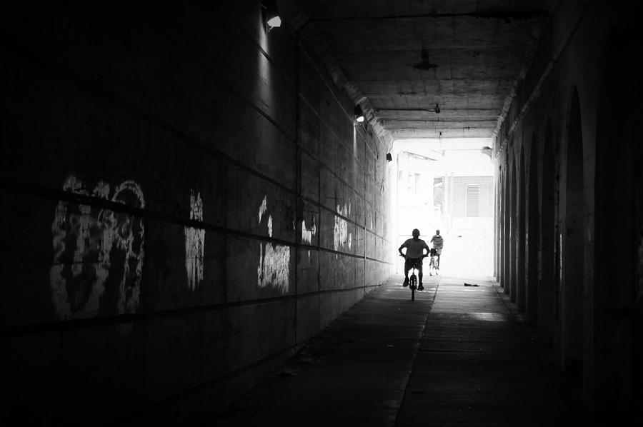 Black And White Photograph - The Cyclists Silhouette by Joseph Skompski