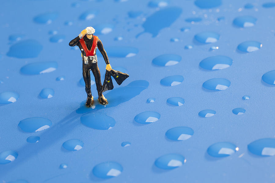 Sports Photograph - The diver among water drops little people big world by Paul Ge