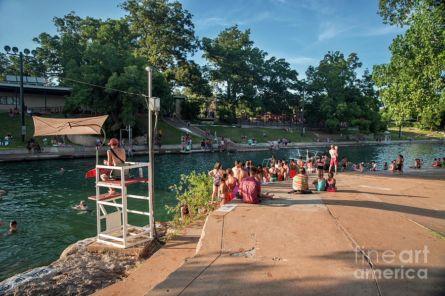 Sunset Photograph - The diving board at Barton Springs Pool is always a popular acti by Dan Herron