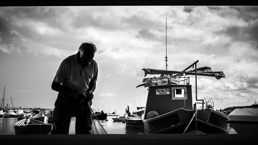 Boat Photograph - The fisherman - Marsaxlokk, Malta - Black and white street photography by Giuseppe Milo