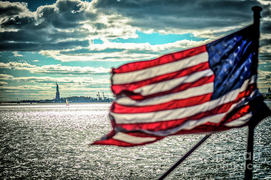 The Flag And Statue Of Liberty Photograph