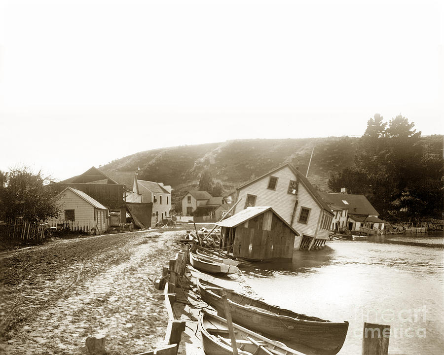 Beach Photograph - The Flagstaff Inn and the Bolinas Tavern on Wharf Road, tipped over 1906 by Monterey County Historical Society