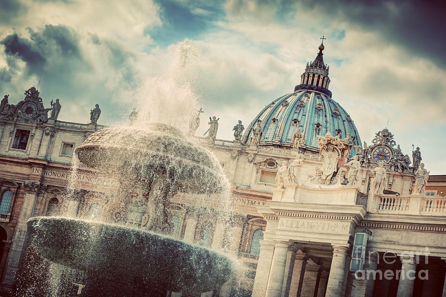 The fountain and the dome of St. Peters Basilica in Vatican City Photograph by Michal Bednarek