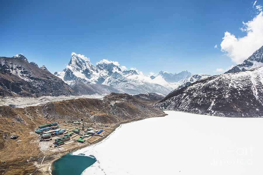 The frozen lake by the Gokyo village Photograph by Didier Marti
