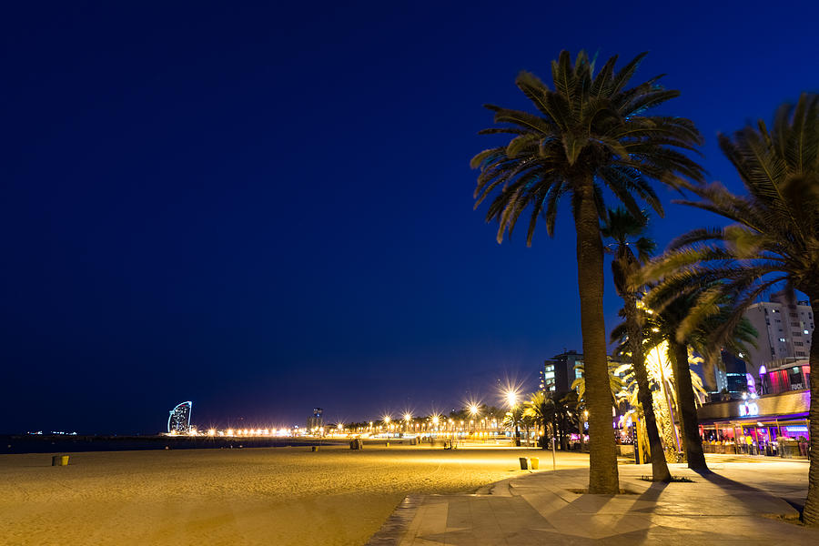 The Golden Beach of Barcelona - Bright Lights Blue Hour in La Barceloneta Photograph by Georgia Mizuleva