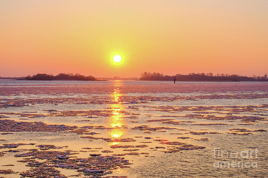 The golden hour and ice drift Photograph by Marina Usmanskaya