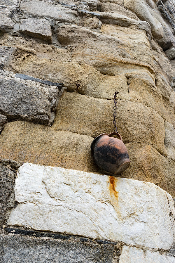 The Hanging Jar - Rough Weathered Stones Rust and Ceramics - a Vertical View Photograph by Georgia Mizuleva