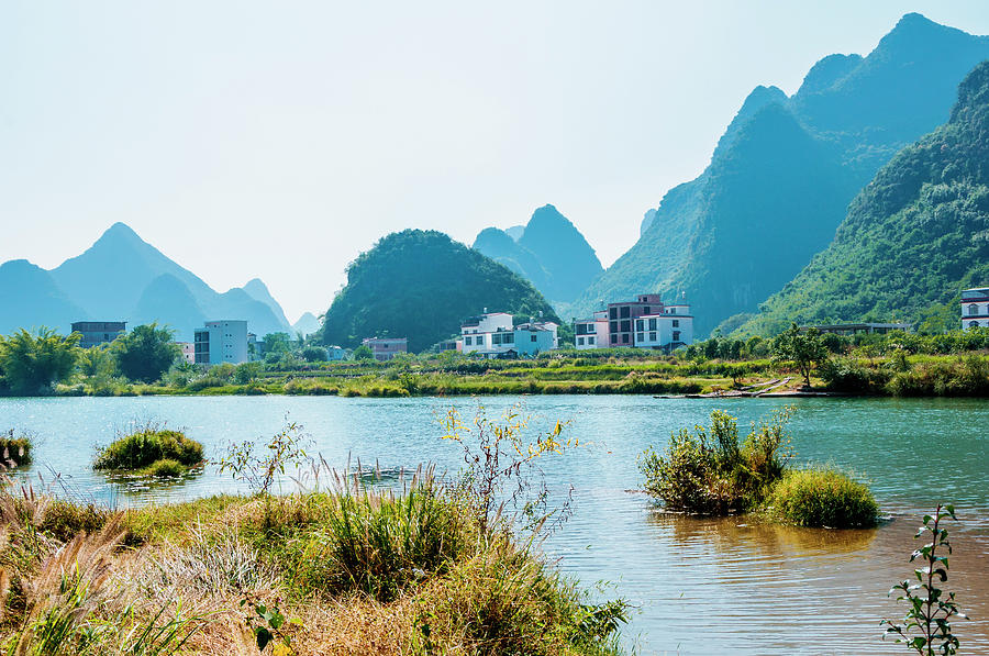 The karst mountains and river scenery Photograph by Carl Ning