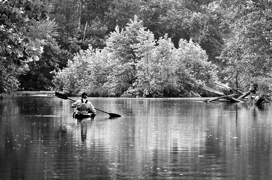 The kayaker Photograph by Robert Charity