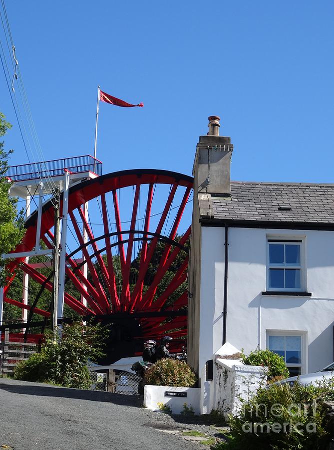 The Laxey Wheel behind a House Photograph by Karen Jane Jones