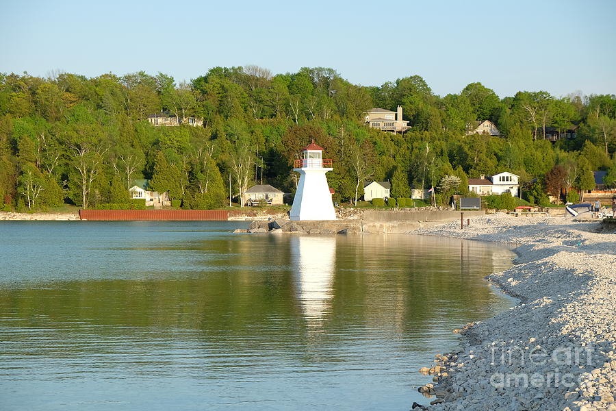 The lighthouse on the lake Photograph by Mini Arora