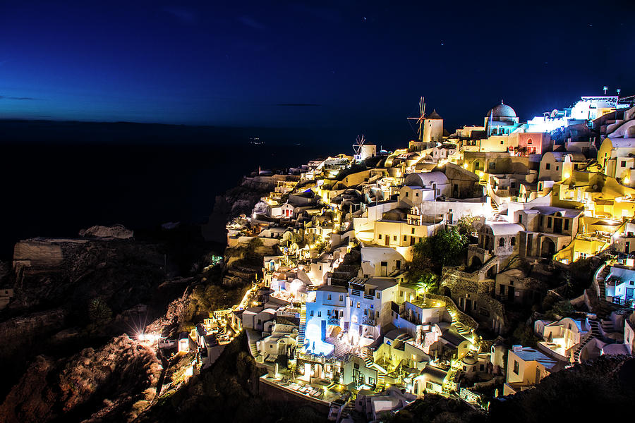 The lights of Oia in Santorini Photograph by Matt McDonald