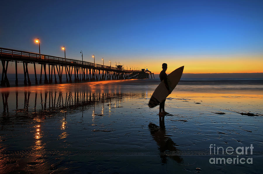 The lone surfer at the Imperial Beach Pier Photograph by Sam Antonio