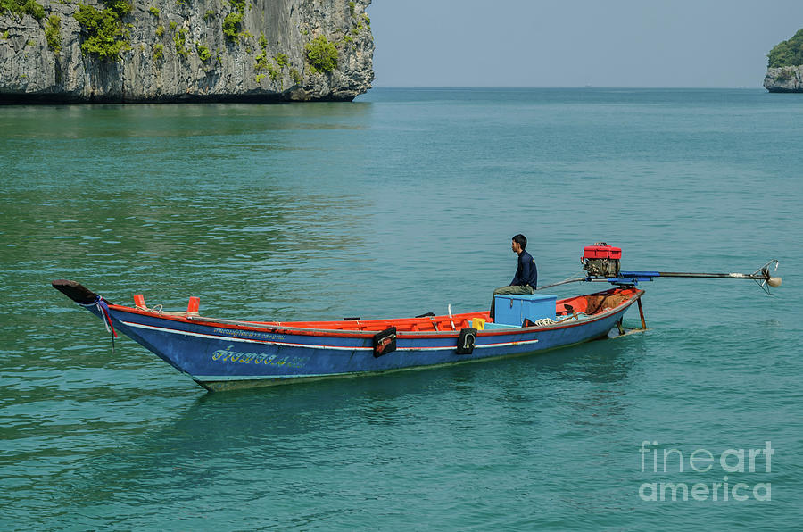 The Man And His Longtail Boat Photograph by Michelle Meenawong