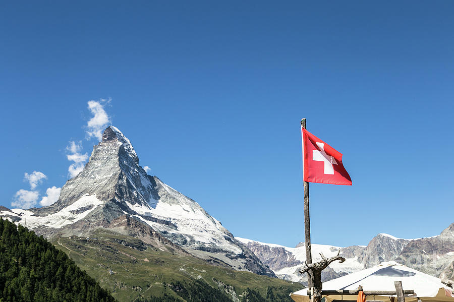 The Matterhorn and the Swiss flag Photograph by Didier Marti