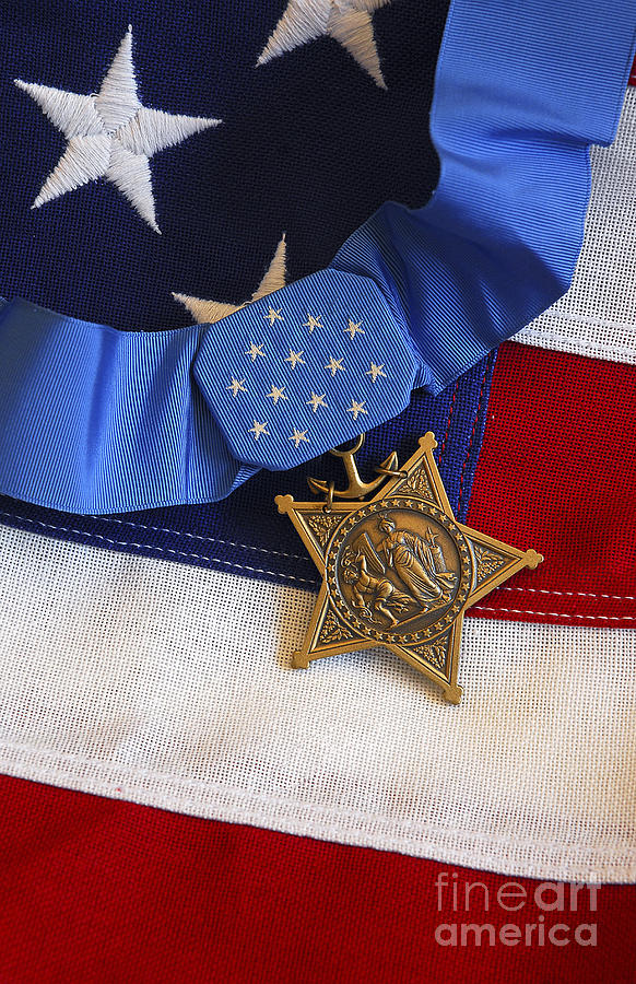 Flag Photograph - The Medal Of Honor Rests On A Flag by Stocktrek Images