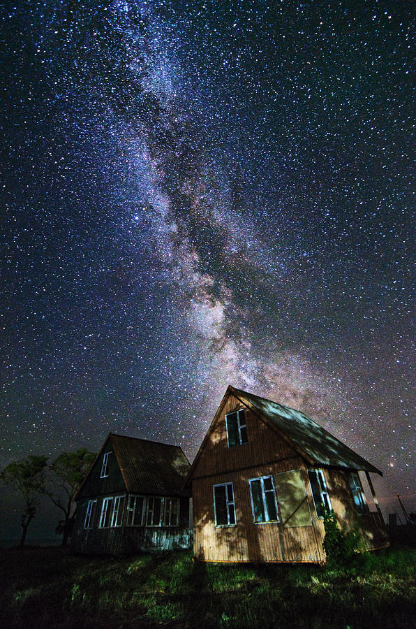Space Photograph - The Milky Way that rises among the houses by Stanislav Salamanov