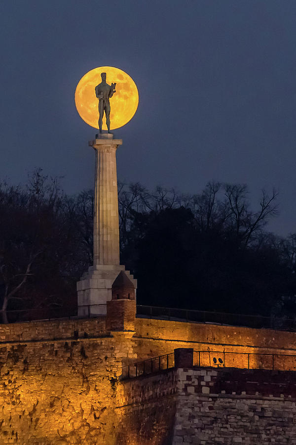 Moon Photograph - The Moon and The Victor in Belgrade by Dejan Kostic Moon Photograph - The Moon and The Victor in Belgrade by Dejan Kostic
