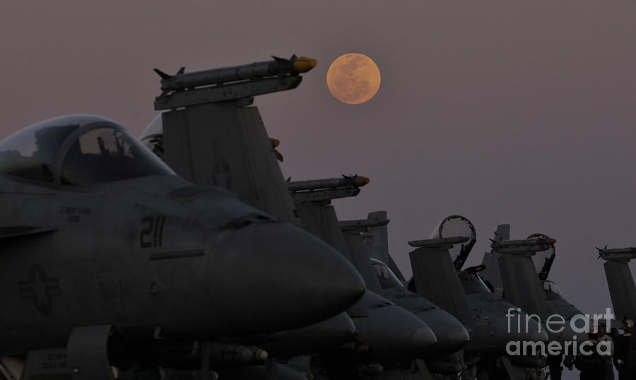 The moon rises over aircraft on the flight deck of USS Carl Vinson. Painting by Celestial Images