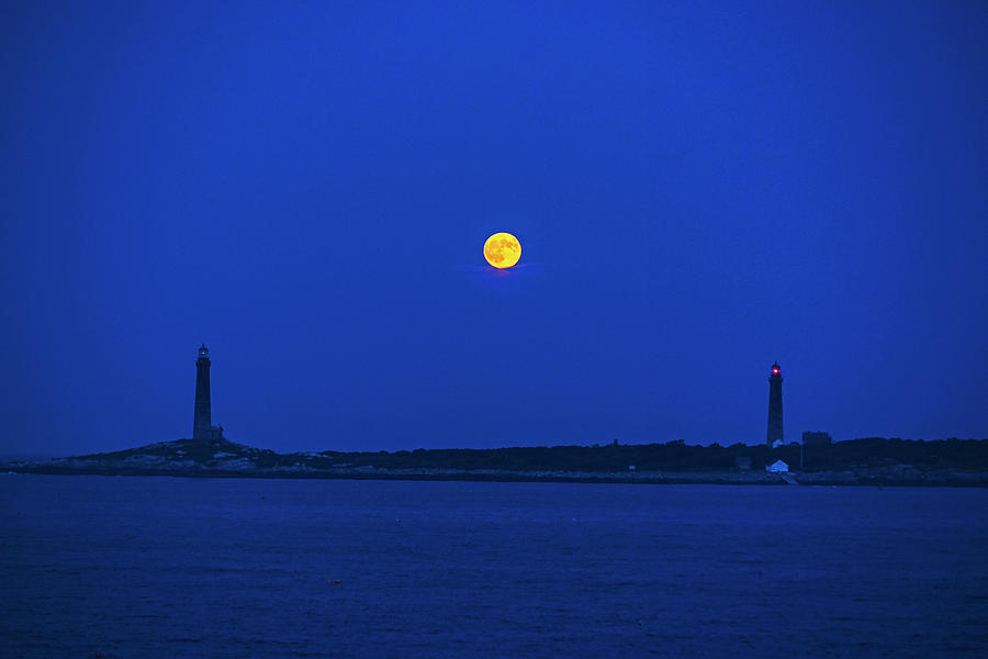 The moon rises over Thacher Island Lighthouse Rockport MA Two Lighthouses Photograph by Toby McGuire