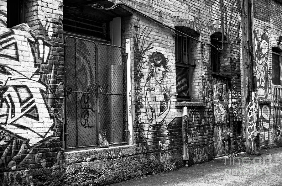 The Muse of the Alley mono Photograph by John Rizzuto