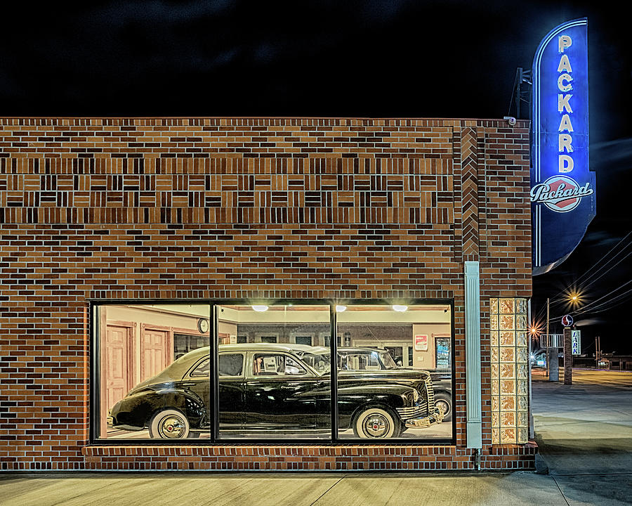 The Old Packard Dealership Photograph by Susan Rissi Tregoning
