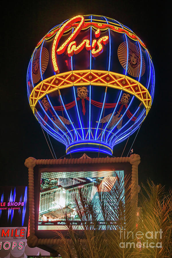 Eiffel Tower Photograph - The Paris Casino Sign at Night by Aloha Art