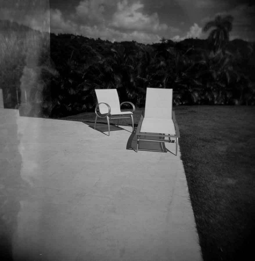 Black And White Photograph - The Patio Chairs by Mauricio Jimenez