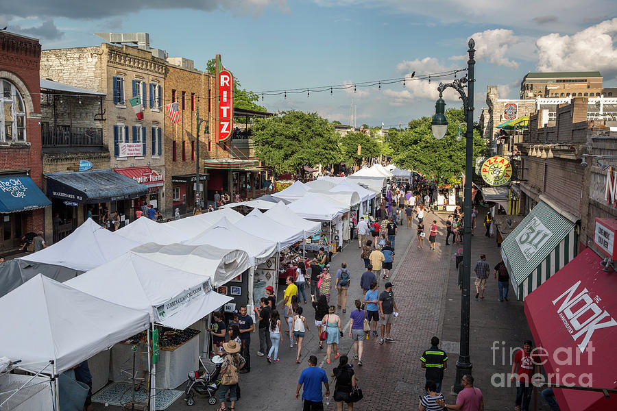 Austin Photograph - The Pecan Street Festival is a arts festival held twice yearly in downtown Austins Sixth Street Historic District and attracts hundreds of local and national artists by Dan Herron