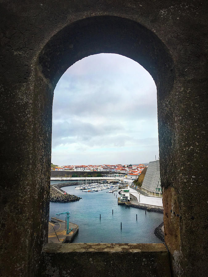 The Port of Angra do Heroismo from a window in Forte de Sao Sebastiao Photograph by Kelly Hazel
