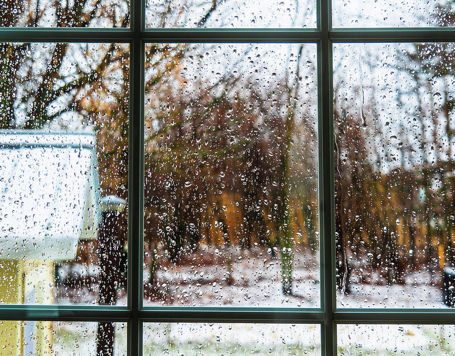 The raindrops are on the window pane. Photograph by Lise Vanasse