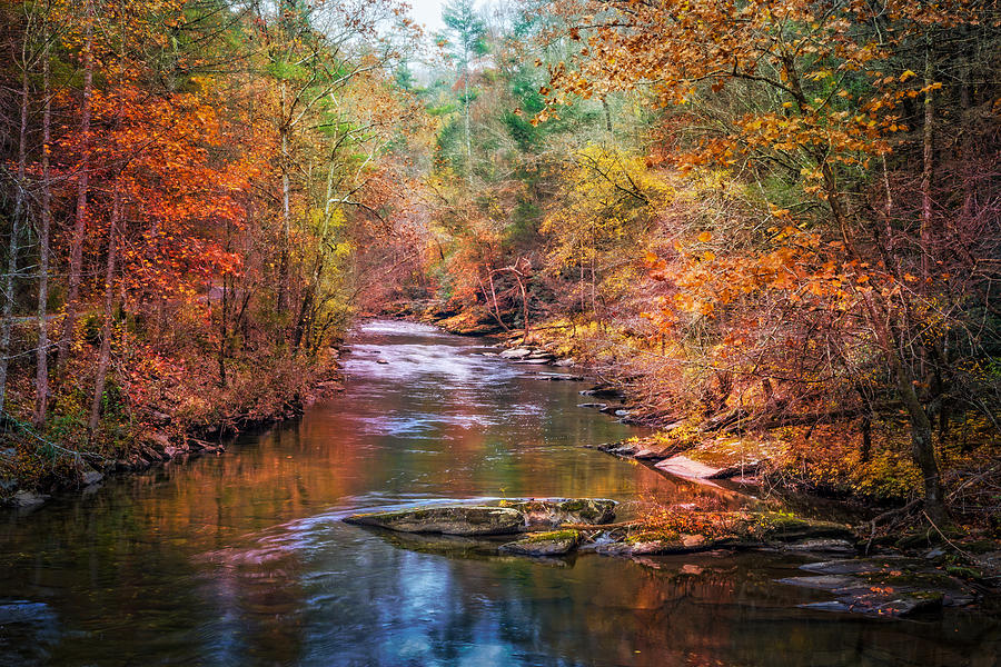 Fall Photograph - The River Runs Cold by Debra and Dave Vanderlaan