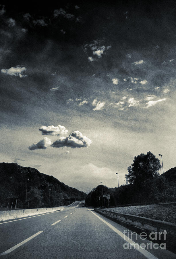 The road and the clouds Photograph by Silvia Ganora