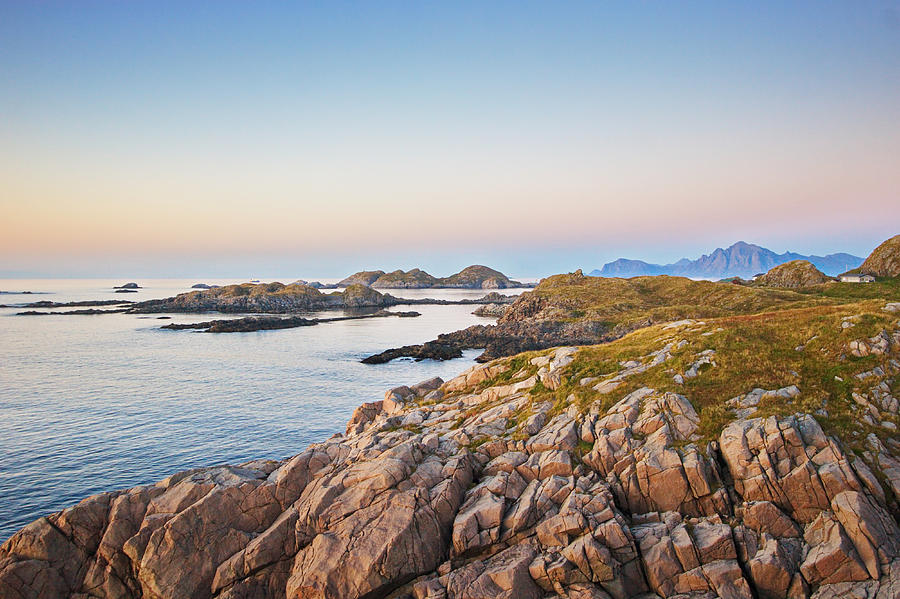 The rocky coast of the North Atlantic near Hovden on island  Langoya at sunset Photograph by Ulrich Kunst And Bettina Scheidulin