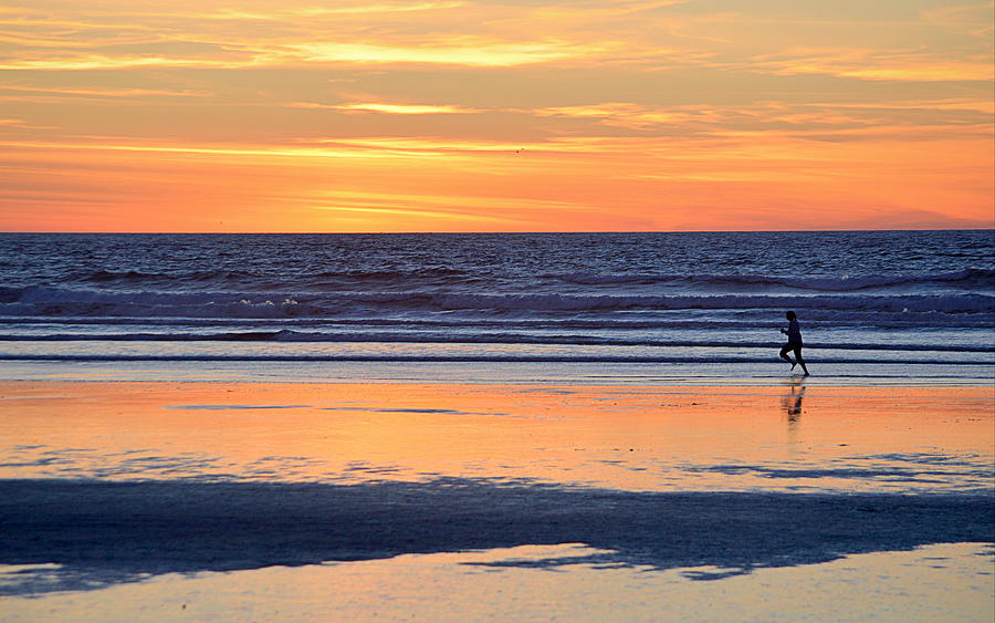 Sunset Photograph - The Runner by AJ  Schibig