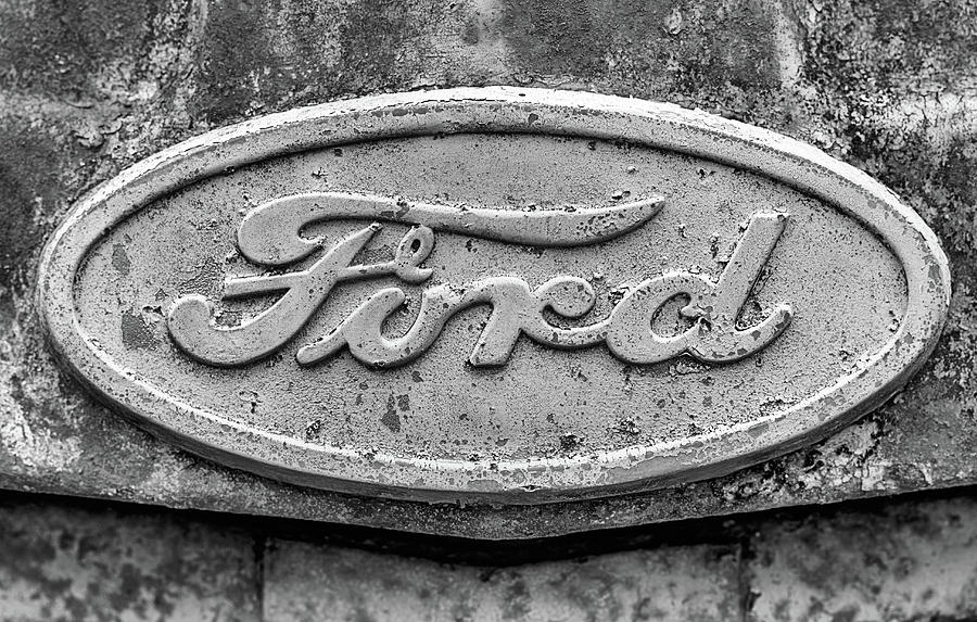 The Rusty Ford Emblem Black and White Photograph by JC Findley