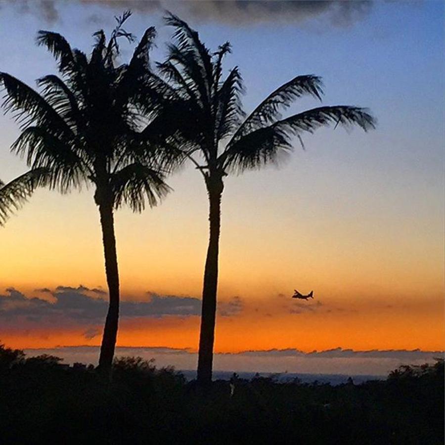 Sunset Photograph - Search plane over Hawaii by Eugene Evon