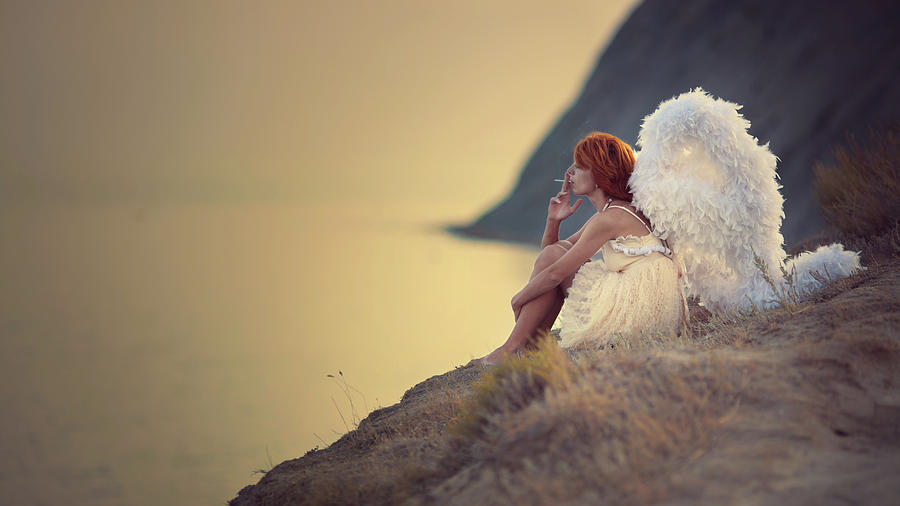 The Smoking Angel On The Cliff Photograph by Anka Zhuravleva