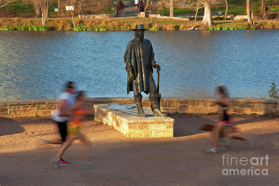 Austin Photograph - The Stevie Ray Vaughan Memorial Statue greets joggers and runners as they zoom by the Lady Bird Lake Hike and Bike Trail by Dan Herron