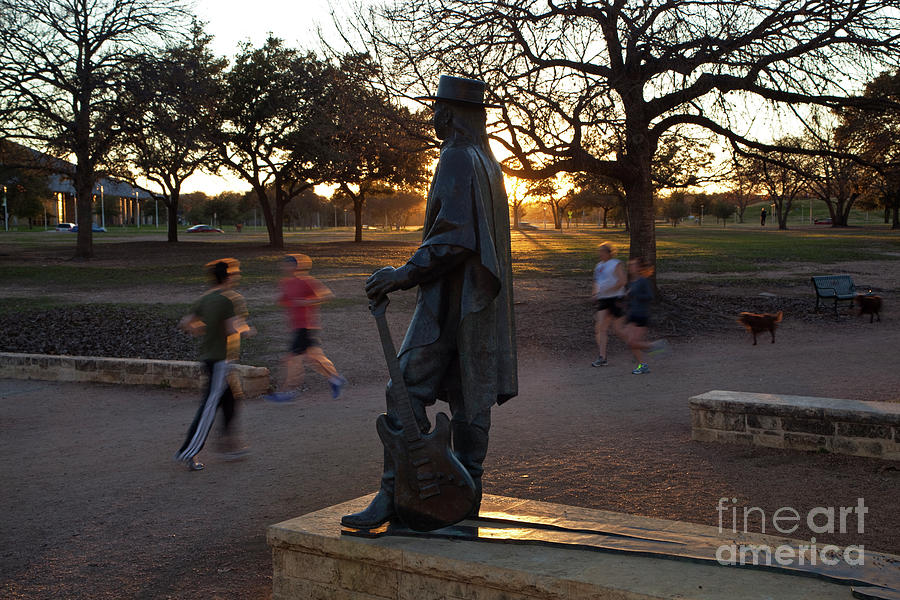 Stevie Ray Vaughan Photograph - The Stevie Ray Vaughan Statue in Austin is an inspirationon the Lady Bird Lake Hike and Bike Trail by Dan Herron