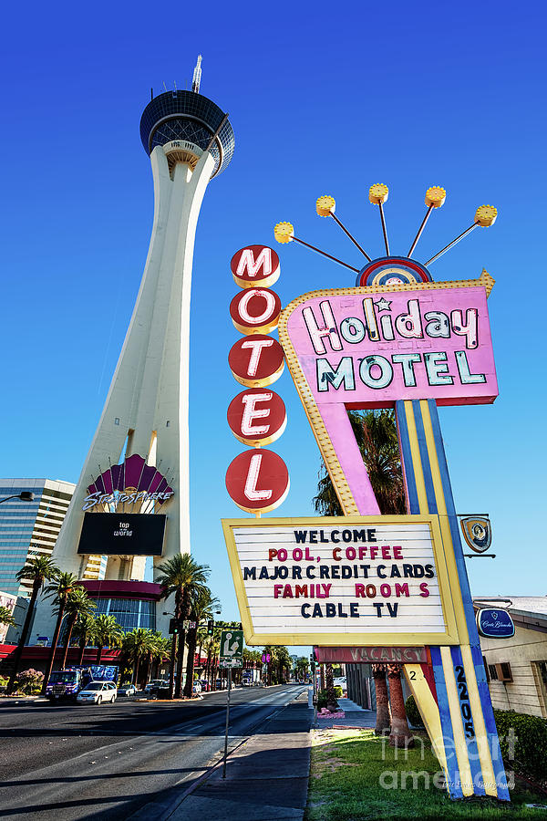 Las Vegas Photograph - The Stratosphere Casino in Front of the Holiday Motel Sign by Aloha Art
