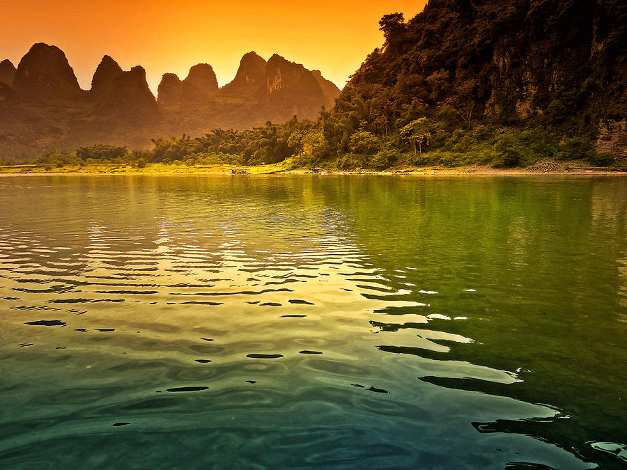 The sun goes down on the mountain-China Guilin scenery Lijiang River in Yangshuo Photograph by Artto Pan