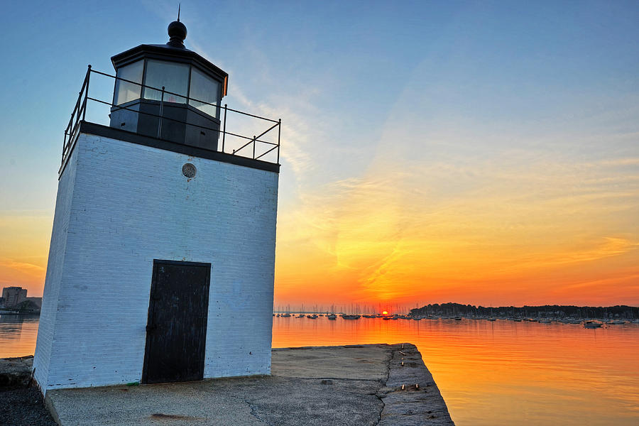 The sun rises on Derby Light in Salem MA Salem Harbor Photograph by Toby McGuire