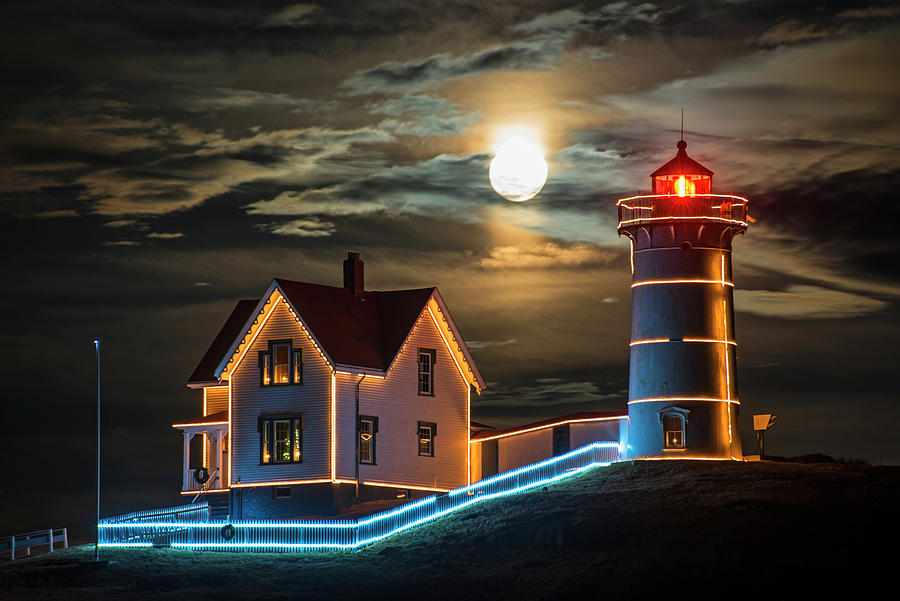 The supermoon rising over the Nubble Lighthouse York Maine Photograph by Toby McGuire