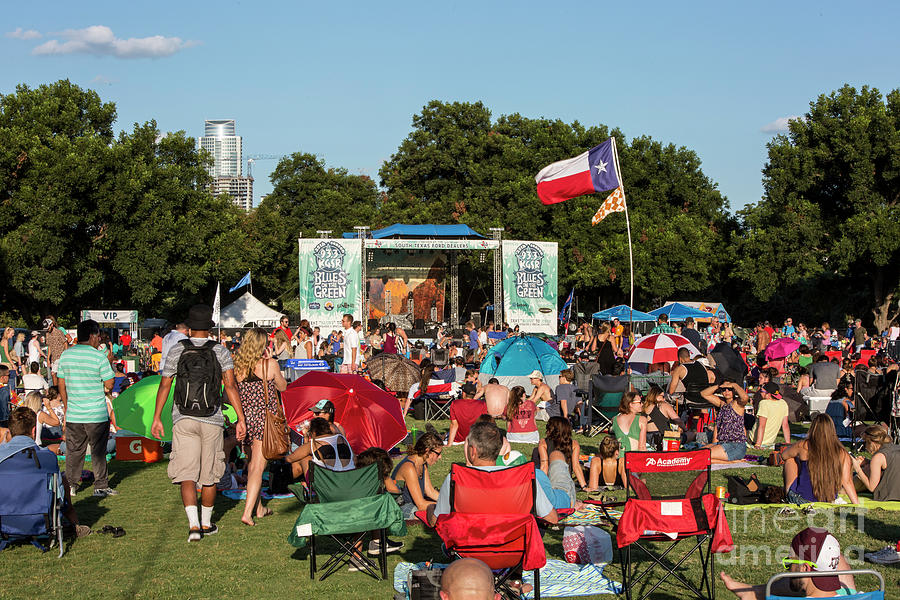 Austin Photograph - The Texas flag boast in the wind at Austins Blues on the Green, a popular free summer concert series by Dan Herron